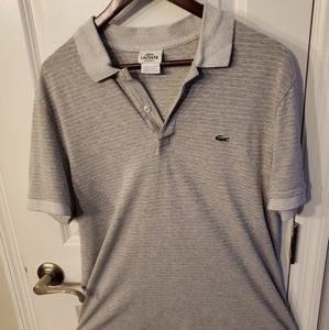 Lacoste Mens polo.. size 6 ( equal to a medium)